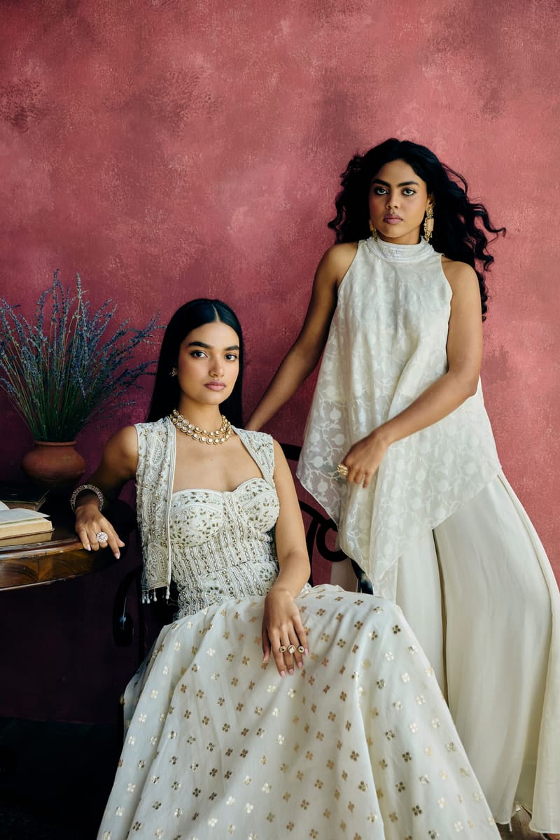 Two women in festive occasion wear at an engagement celebration